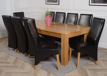 Dakota Extra Large Oak Dining Table with 10 Lola Black Leather Chairs