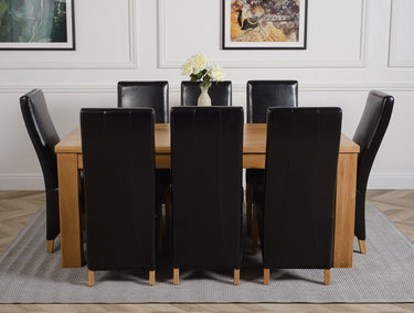 Dakota Large Oak Dining Table with 8 Lola Black Leather Chairs