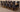Richmond Large Oak Extending Dining Table with 10 Washington Black Fabric Chairs