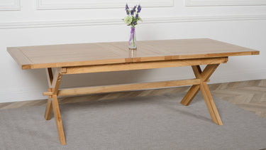 Vermont Cross Leg Oak Extending Dining Table with 8 Lola Black Leather Chairs